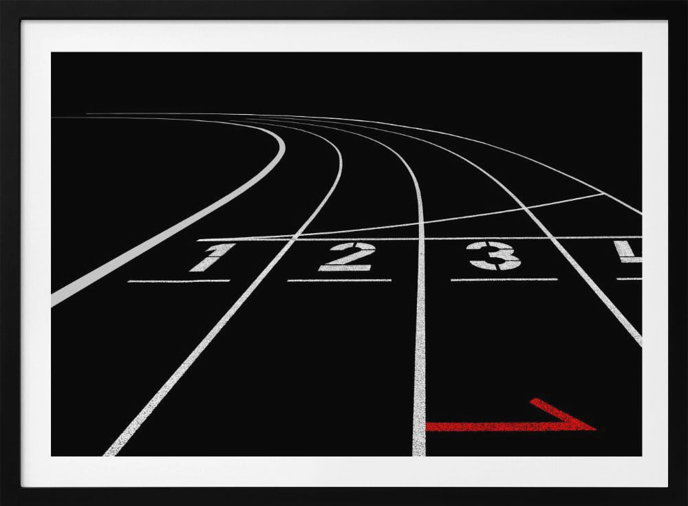 A framed, high-contrast photograph of a black running track's starting line. The lanes, marked with white lines, are numbered 1, 2, 3, and 4 and curve into the distance. A single red arrow points forward in the foreground, adding a pop of color to the monochrome scene. Poster