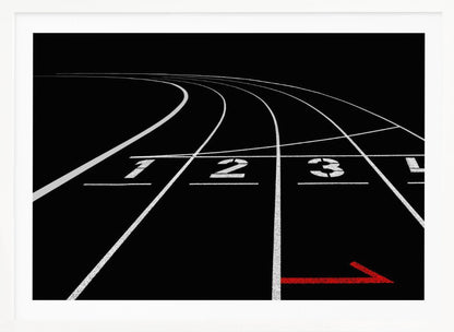 A framed, high-contrast photograph of a black running track's starting line. The lanes, marked with white lines, are numbered 1, 2, 3, and 4 and curve into the distance. A single red arrow points forward in the foreground, adding a pop of color to the monochrome scene. Poster