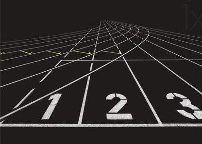 A framed, high-contrast graphic of a black running track from a low-angle perspective at the starting line. White lines delineate the lanes, with the numbers 1, 2, and 3 stenciled in the foreground. The track curves and recedes into the distance, creating a strong sense of perspective. Decor