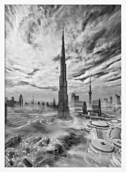 A dramatic black and white high-angle photograph of the Burj Khalifa dominating the Dubai cityscape, with swirling clouds above and a light mist surrounding the buildings below, all enclosed in a black frame. Poster