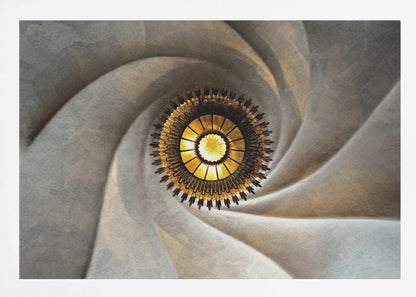A low-angle, centered photograph looking up at an ornate, golden sunburst chandelier hanging from the vortex of a swirling, textured cream-colored ceiling, enclosed in a silver frame. Poster
