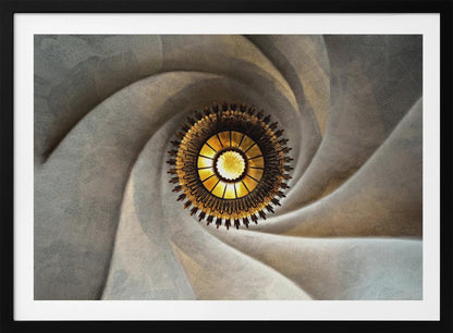 A low-angle, centered photograph looking up at an ornate, golden sunburst chandelier hanging from the vortex of a swirling, textured cream-colored ceiling, enclosed in a silver frame. Poster