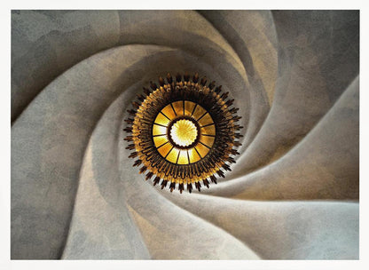A low-angle, centered photograph looking up at an ornate, golden sunburst chandelier hanging from the vortex of a swirling, textured cream-colored ceiling, enclosed in a silver frame. Poster