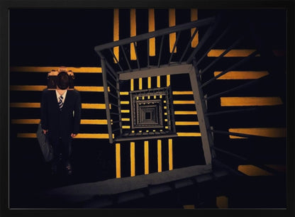A surreal high-angle view looking down an infinite square spiral staircase with black steps and bold yellow stripes. On a landing stands a man in a dark suit and tie, holding a briefcase, with a vintage camera in place of his head. Artwork