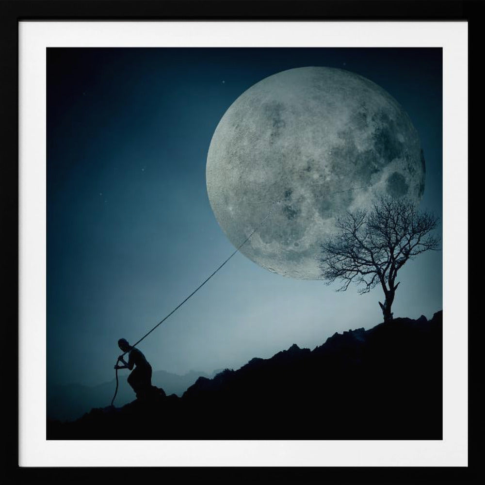 A surreal, framed artwork depicting a silhouette of a person on a dark, rocky hill at night, pulling a rope attached to a massive, detailed full moon, seemingly trying to pull it from the dark blue, star-dusted sky. A bare, silhouetted tree stands on the same hill. Artwork