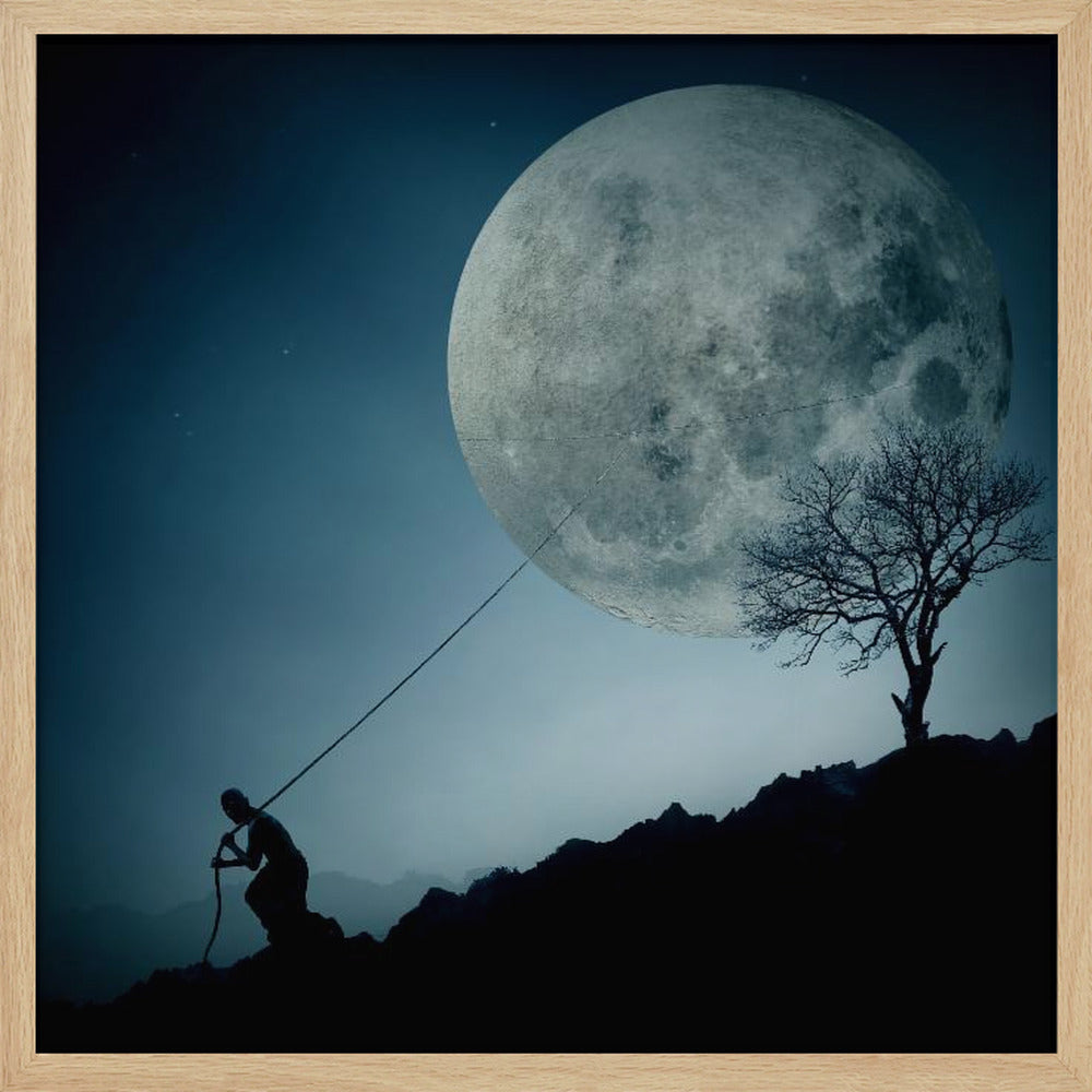 A surreal, framed artwork depicting a silhouette of a person on a dark, rocky hill at night, pulling a rope attached to a massive, detailed full moon, seemingly trying to pull it from the dark blue, star-dusted sky. A bare, silhouetted tree stands on the same hill. Artwork