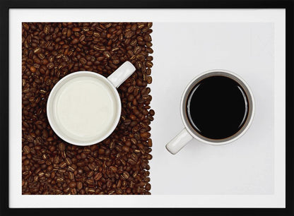 A top-down, split-screen photograph showing a contrast between coffee and milk. On the left, a white mug of milk sits on a bed of roasted coffee beans. On the right, a white mug of black coffee rests on a clean white background, creating a stark visual divide. Artwork