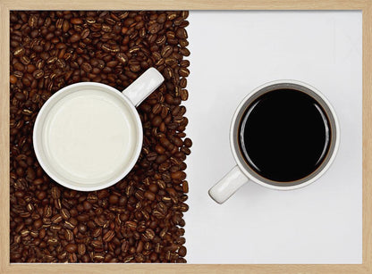 A top-down, split-screen photograph showing a contrast between coffee and milk. On the left, a white mug of milk sits on a bed of roasted coffee beans. On the right, a white mug of black coffee rests on a clean white background, creating a stark visual divide. Artwork
