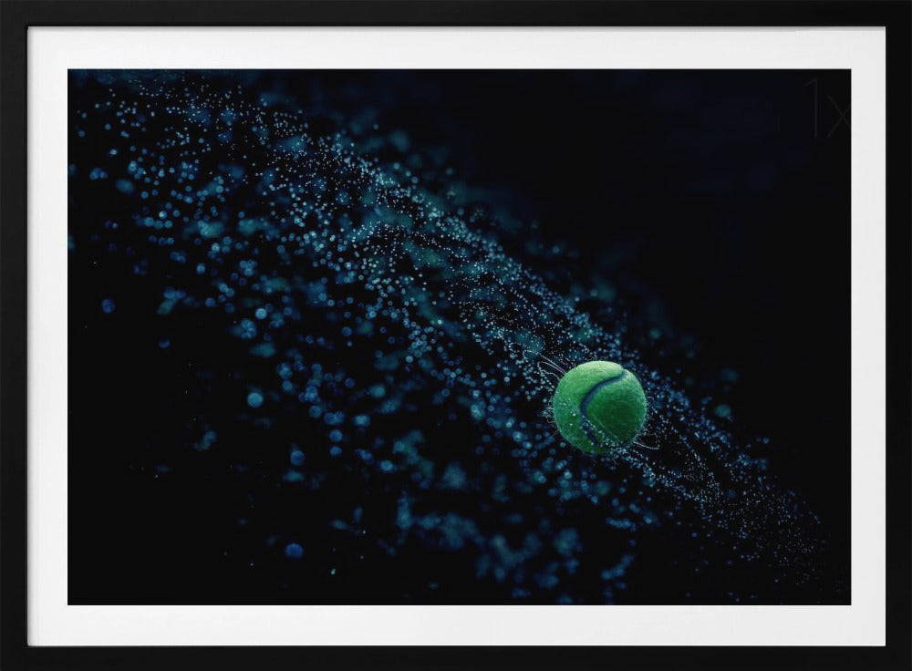 A high-speed photograph captures a spinning green tennis ball against a black background, with a dramatic spray of blue-lit water droplets flying off it in a cosmic-like spiral. Artwork