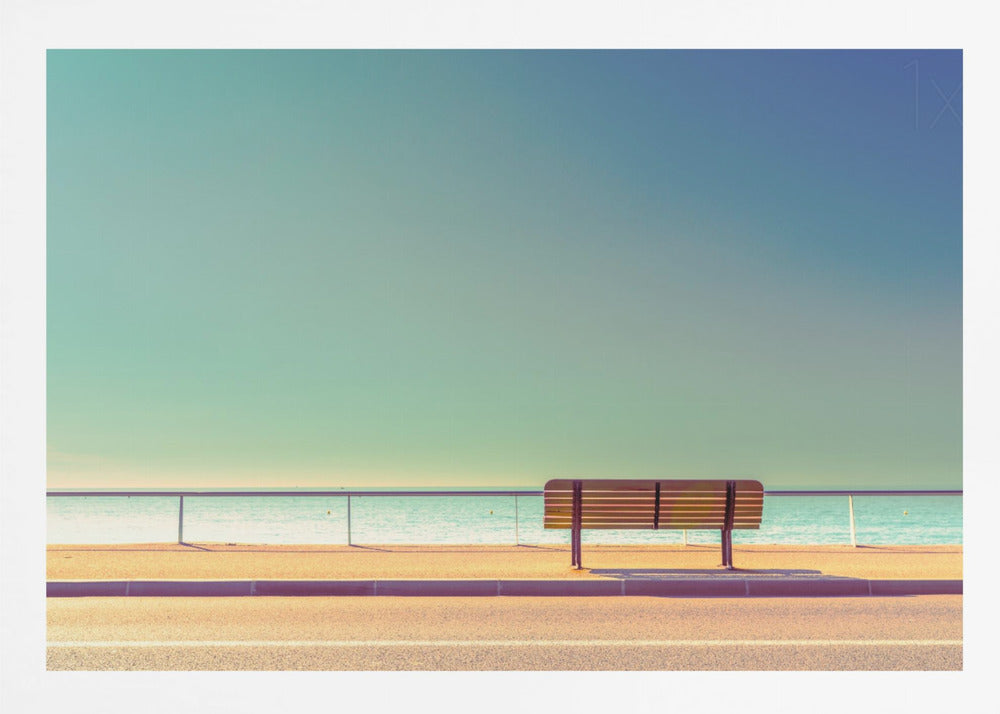 A minimalist, retro-toned photograph of a solitary wooden bench on a sunlit seaside promenade, overlooking a calm turquoise ocean under a vast, clear blue-green sky. Poster
