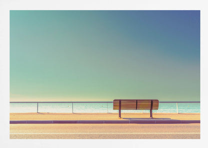 A minimalist, retro-toned photograph of a solitary wooden bench on a sunlit seaside promenade, overlooking a calm turquoise ocean under a vast, clear blue-green sky. Poster