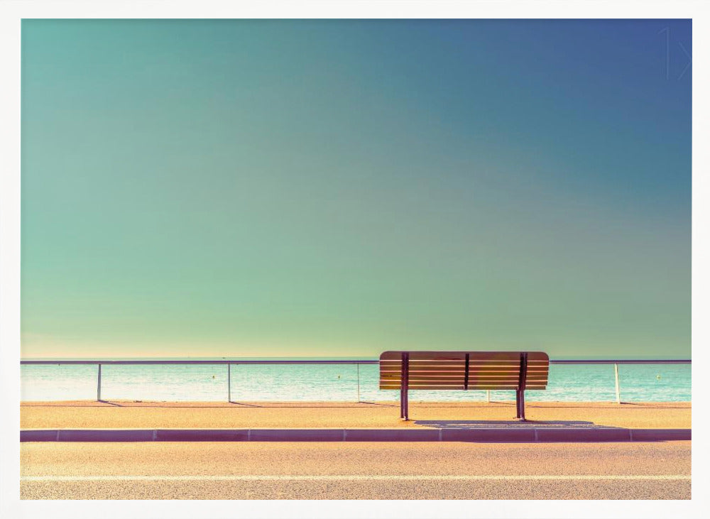 A minimalist, retro-toned photograph of a solitary wooden bench on a sunlit seaside promenade, overlooking a calm turquoise ocean under a vast, clear blue-green sky. Poster
