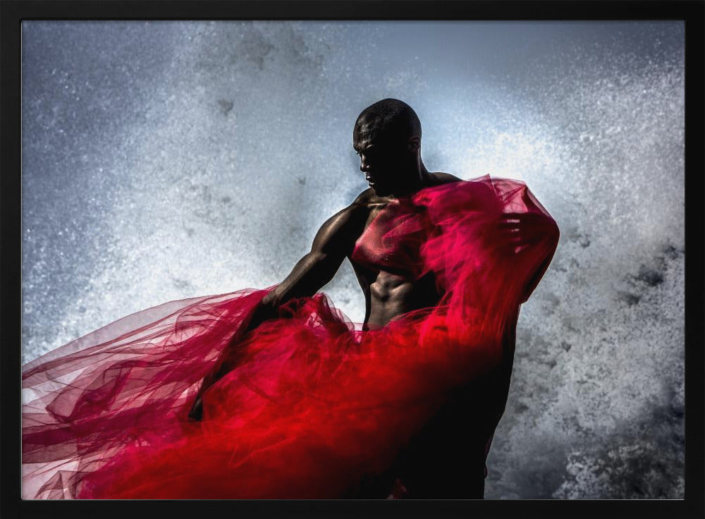 A dramatic photograph of a muscular Black man, mostly in shadow, holding a voluminous, sheer red fabric against a backdrop of splashing white water. The image is encased in a silver frame. Poster