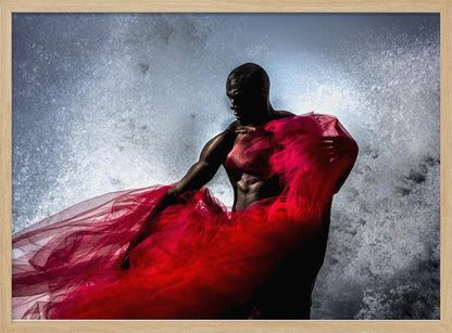 A dramatic photograph of a muscular Black man, mostly in shadow, holding a voluminous, sheer red fabric against a backdrop of splashing white water. The image is encased in a silver frame. Poster