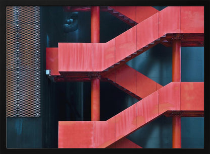 A framed abstract architectural photograph of a bright red industrial staircase zig-zagging against a dark teal wall. The composition highlights the geometric shapes and bold color contrast between the red stairs and the cool-toned background, with a silver mesh panel visible on the left side. Print