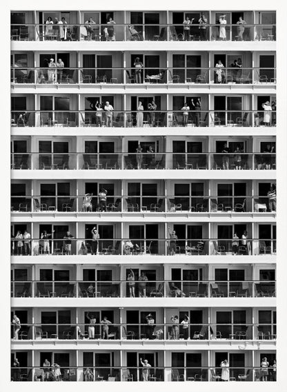 A black and white, high-contrast photograph of the side of a cruise ship, showing a grid of balconies across multiple decks. Various passengers are visible on their balconies, some waving, some relaxing, and some observing, creating a pattern of individual human stories within the repetitive architectural structure. Poster