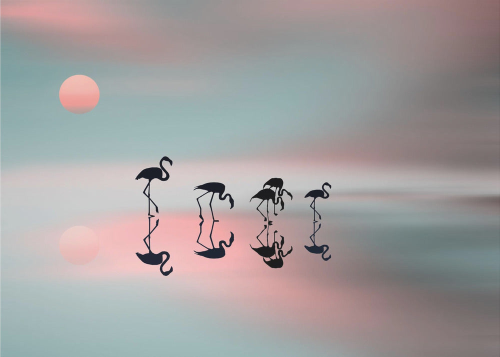 A serene artwork of five black flamingo silhouettes wading in calm water, their reflections mirrored below them. The background is a soft, blurred gradient of pastel pink and teal, with a pale pink sun low in the sky, creating a tranquil sunset scene. Poster
