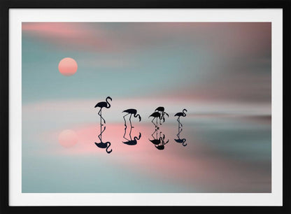 A serene artwork of five black flamingo silhouettes wading in calm water, their reflections mirrored below them. The background is a soft, blurred gradient of pastel pink and teal, with a pale pink sun low in the sky, creating a tranquil sunset scene. Poster