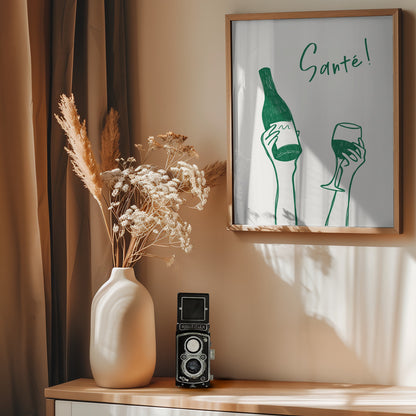 Hands holding a wine bottle and a wine glass with the text "Cheers!" in French - Poster / Art Print - interiör