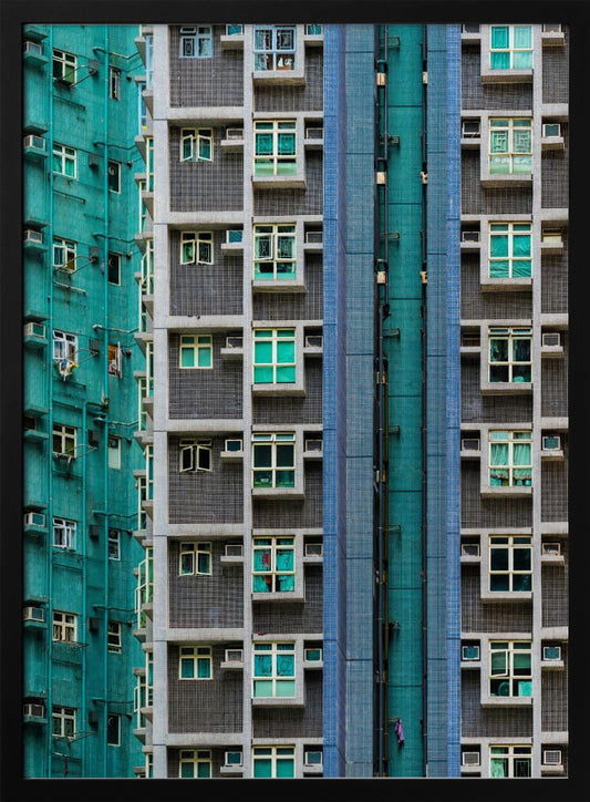 A striking close-up of two densely packed apartment buildings, one with a teal tiled facade and the other with a grey and blue tiled facade, creating a strong pattern of repeating windows and geometric lines. Decor
