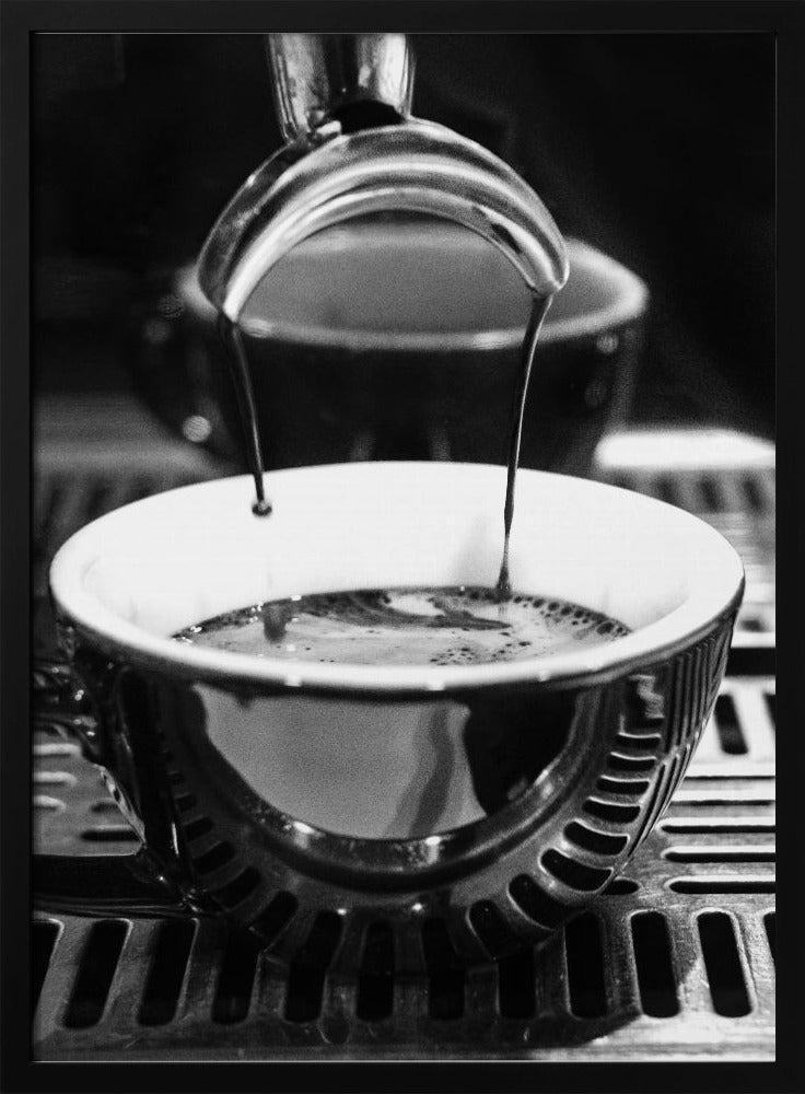 A close-up, black and white artistic photograph capturing the moment two streams of dark espresso pour from a portafilter into a waiting cup on a coffee machine's drip tray. Wall Art