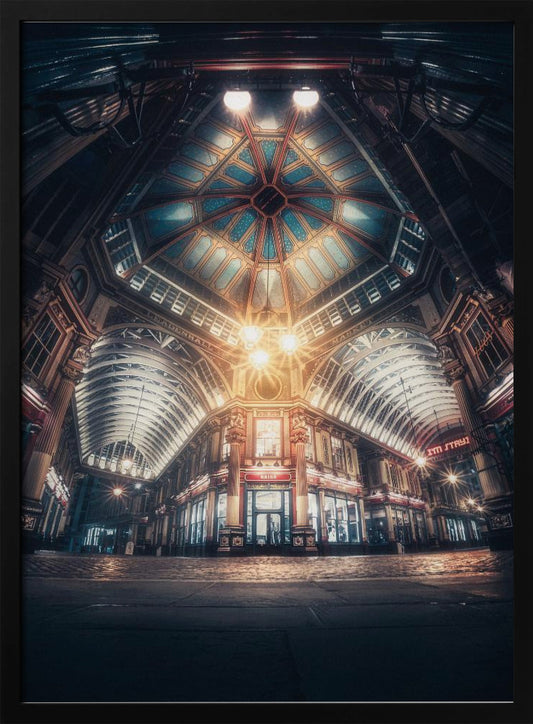 A dramatic, low-angle, wide shot of an empty Leadenhall Market at night. The ornate, domed ceiling is illuminated in blue and gold by bright, warm lights, which also cast a glow on the cobblestone floor and detailed Victorian storefronts. Wall Art