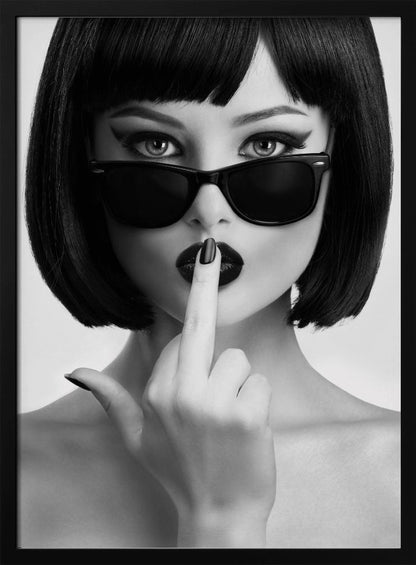 A striking black and white portrait of a woman with a sharp bob haircut, sunglasses, and bold makeup. She holds one finger with a black-painted nail up to her dark lips, making a 'shushing' gesture. Poster