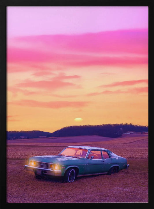A vintage green muscle car is parked in a purple-hued field under a vibrant sunset sky that blends from orange to a vivid pink. The car's headlights are glowing, and the sun is setting behind distant hills, creating a dreamy, retro atmosphere. Decor