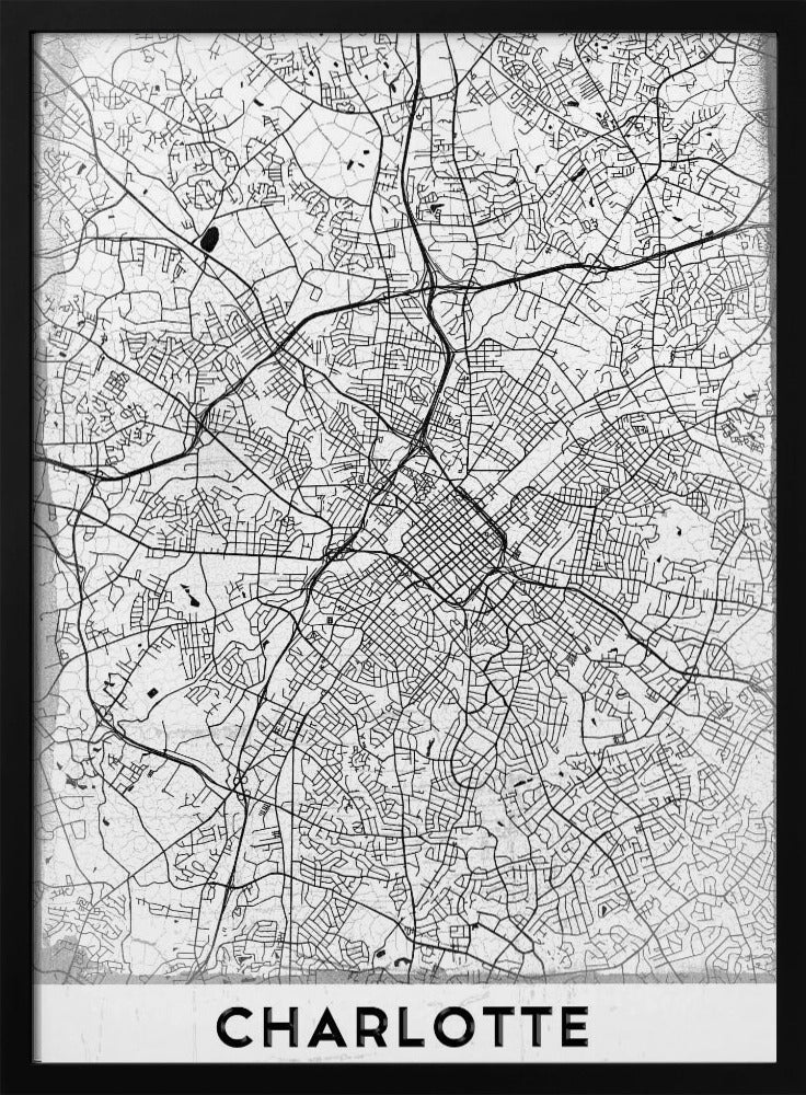 A minimalist black and white map of Charlotte, North Carolina, displayed in a black frame. The map details the intricate network of city streets and highways. At the bottom, a white banner features the city's name 'CHARLOTTE' in a bold, black, sans-serif font. Poster