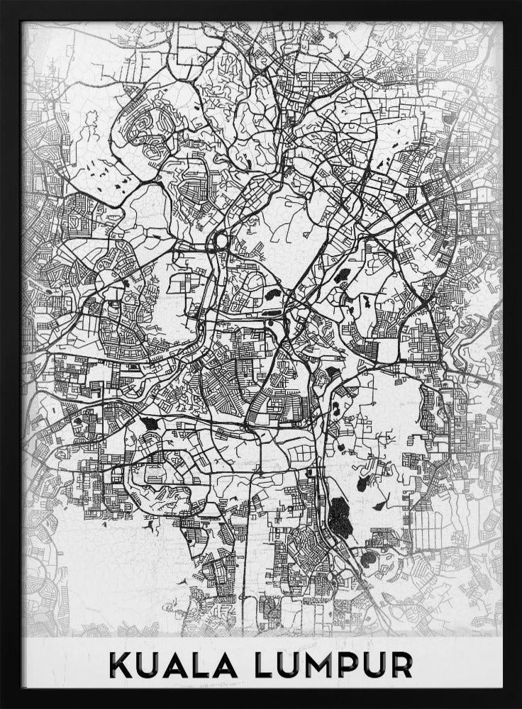 A minimalist black and white street map of Kuala Lumpur, displayed in a black frame. The map shows a detailed network of roads and city blocks on a textured white background. The name "KUALA LUMPUR" is printed in a bold, modern font at the bottom. Decor