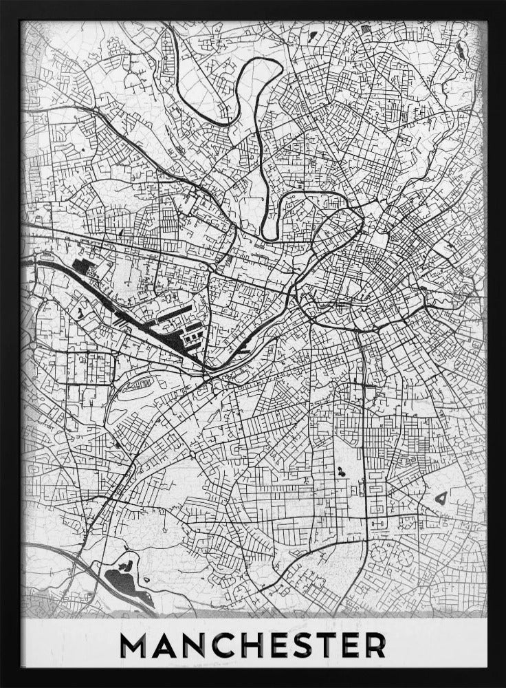 A minimalist black and white street map of Manchester, UK, displayed in a simple black frame. The map details the intricate network of roads and waterways, with the city's name 'MANCHESTER' printed in a bold, modern font at the bottom. Wall Art