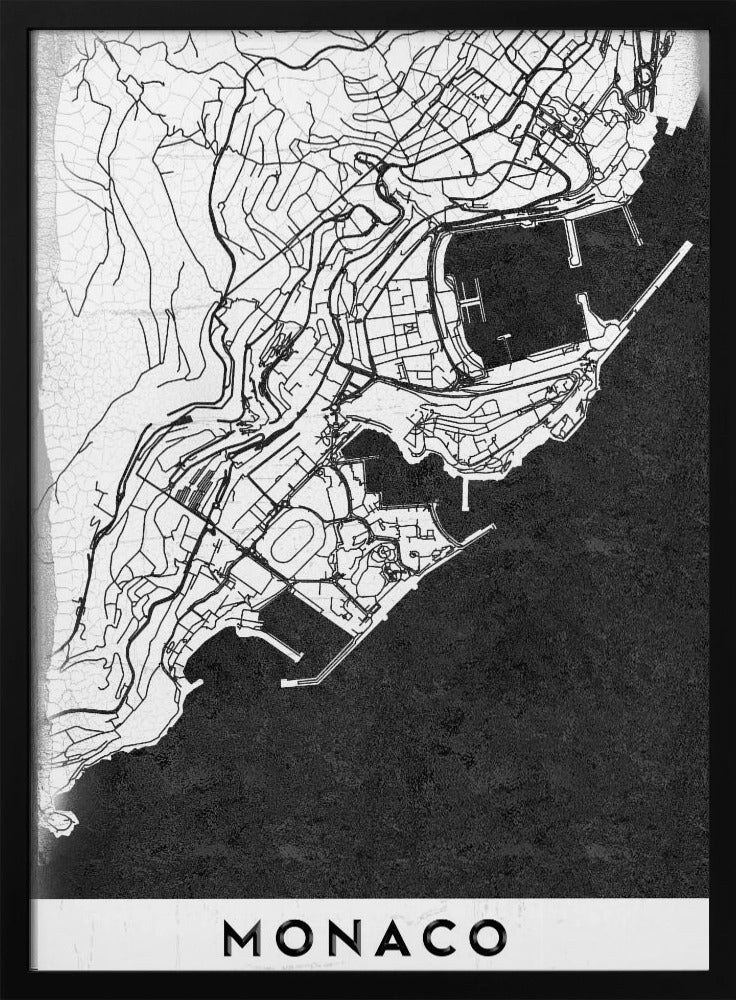 A modern black and white map of Monaco, presented as a framed poster. The map details the city's streets and coastline in black lines on a white background, while the sea is depicted in a solid, textured black. The title 'MONACO' is at the bottom in a bold, white band. Poster