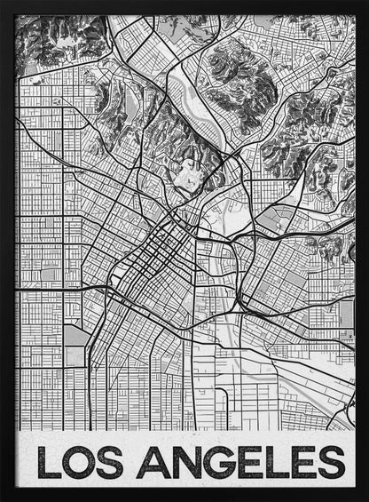 A modern, framed black and white map of Los Angeles. The detailed illustration features a dense grid of city streets, winding highways, rivers, and topographic details of hills. A white banner at the bottom displays the words 'LOS ANGELES' in a bold, black, textured font. Poster