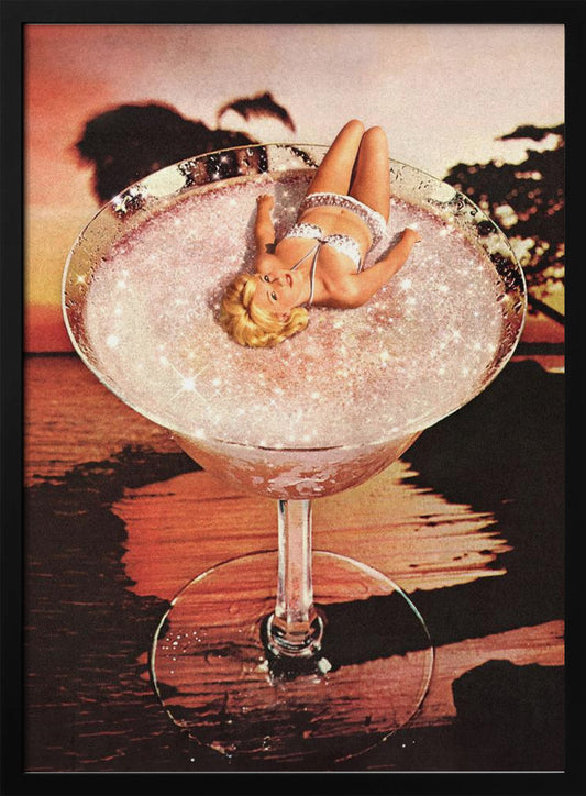 A surreal collage featuring a blonde woman in a white bikini lounging in a giant cocktail glass filled with a sparkling pink liquid, set against a warm sunset over the ocean. Print