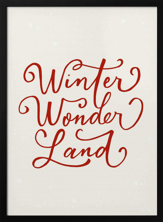 A holiday-themed art print with the words 'Winter Wonder Land' written in a flowing red script font on a speckled, off-white background, all enclosed within a simple black frame. Artwork