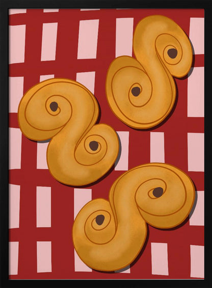 A vibrant illustration of three golden-yellow S-shaped pastries, resembling Swedish saffron buns, resting on a red and pink checkered tablecloth. The artwork is presented within a black frame. Decor