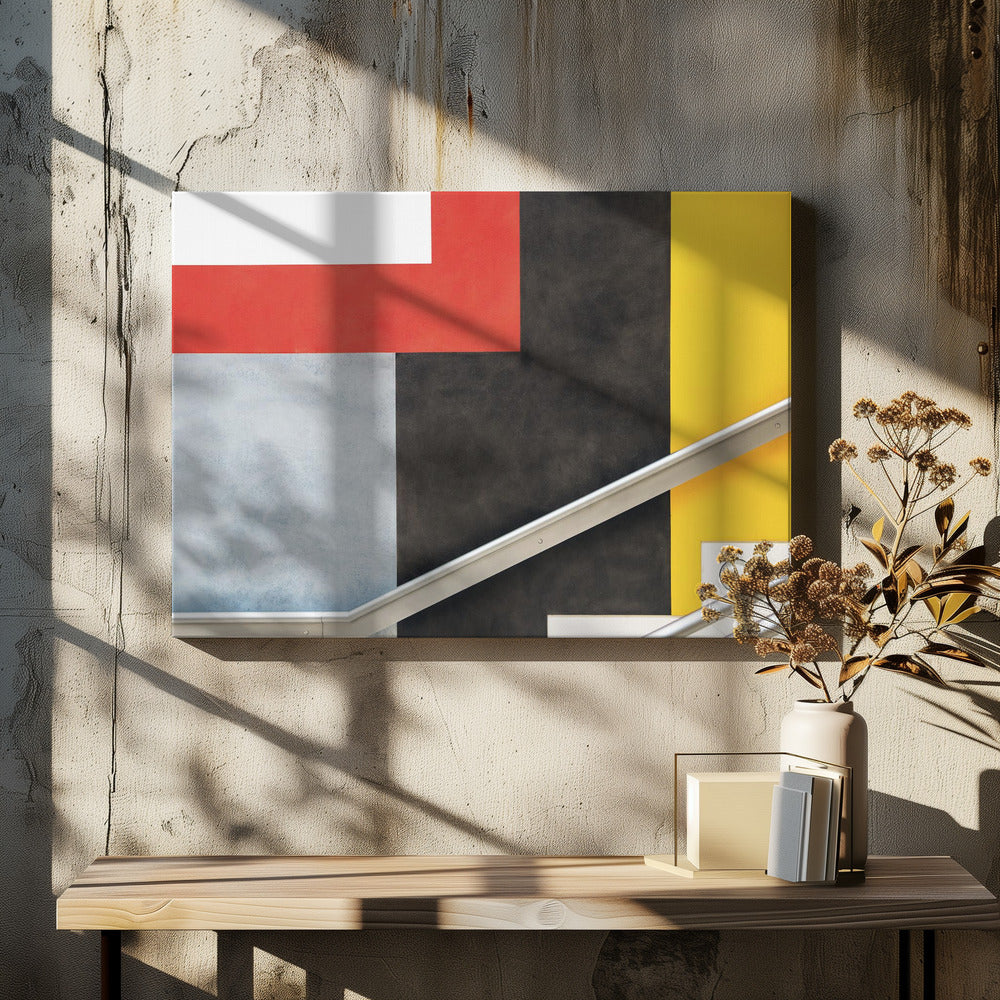A framed abstract art piece featuring a composition of large, solid-colored geometric shapes in red, yellow, black, white, and light gray. A silver handrail cuts diagonally across the lower portion of the image, adding a sharp line and a sense of architectural space. Artwork