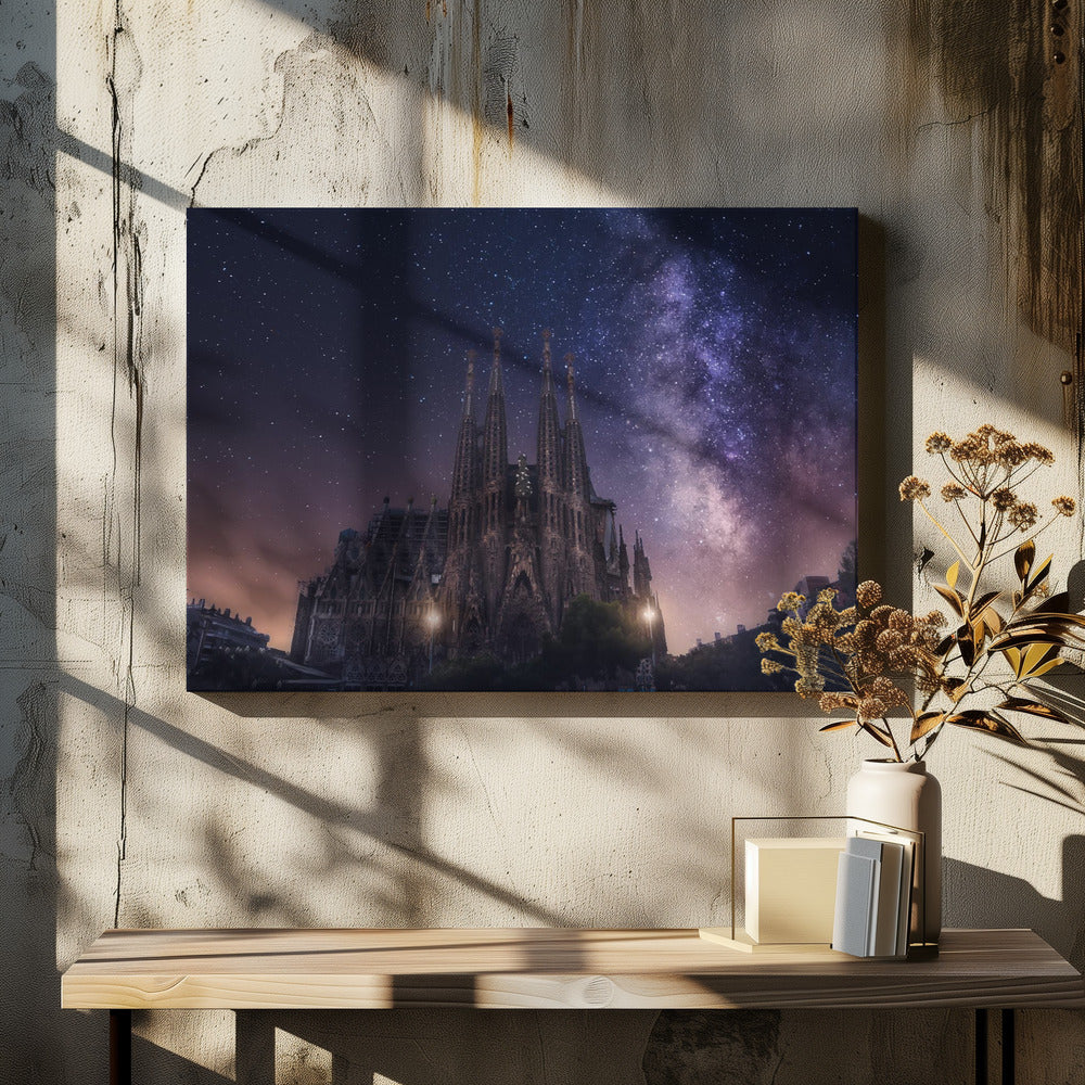 A fantastical night view of the Sagrada Familia in Barcelona, its intricate spires reaching up towards a magnificent, starry sky filled with the purple and pink hues of the Milky Way galaxy, all enclosed in a silver frame. Artwork