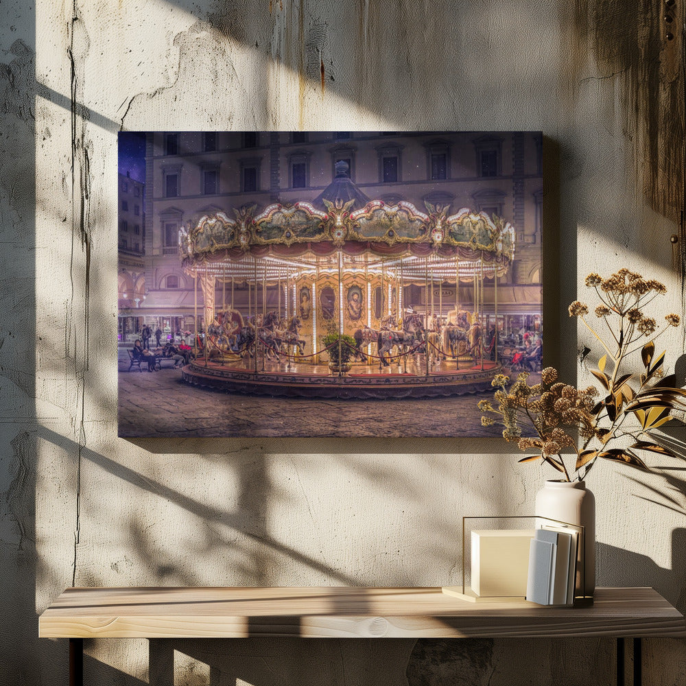 A beautifully illuminated vintage carousel with ornate horses in a European cobblestone plaza at night. The carousel is the central focus, glowing with warm lights against a backdrop of historic buildings and a starry purple sky. Poster