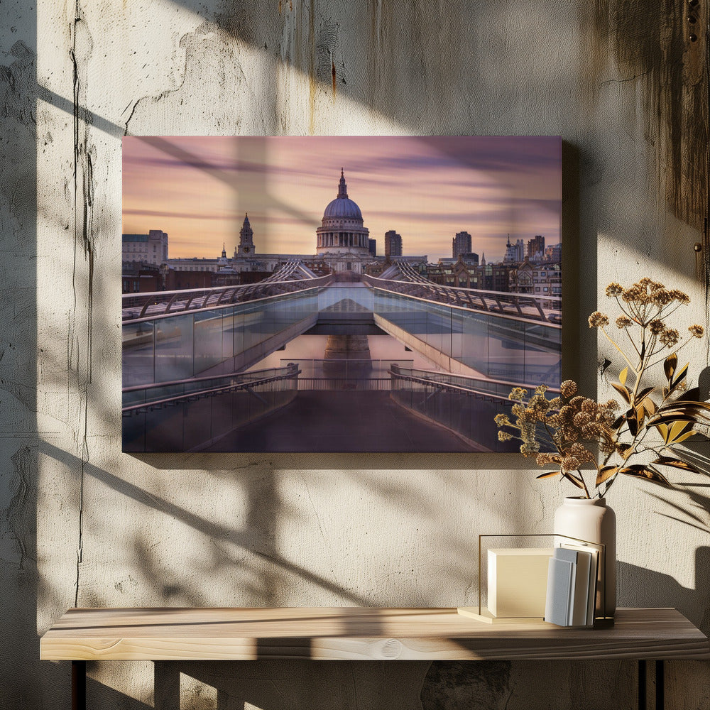 A photograph looking down the center of the Millennium Bridge in London, leading the eye directly to St. Paul's Cathedral, which is centered in the background under a beautiful purple and orange sunset sky. Print