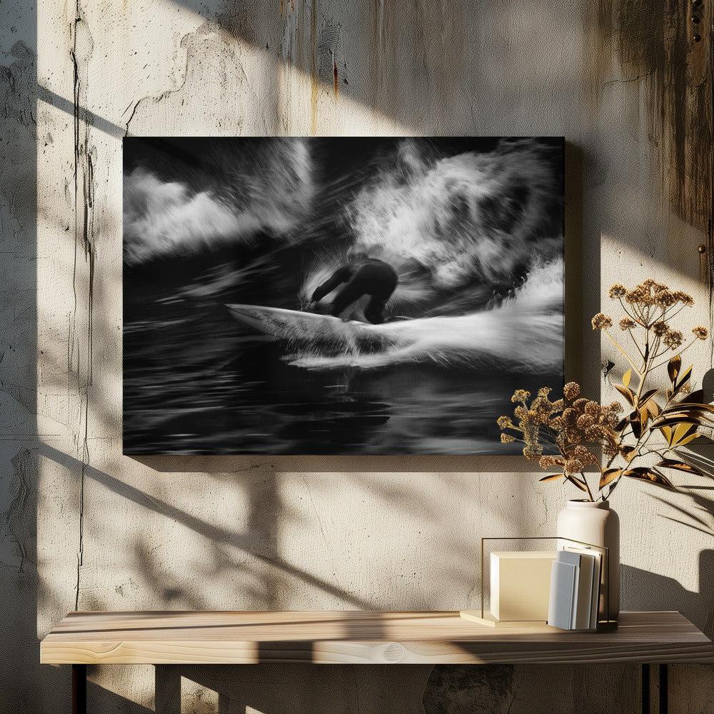 A dynamic black and white action photograph of a surfer in a dark wetsuit, crouched low on a surfboard while riding a powerful wave. Motion blur captures the speed and energy of the moment, with white water spray exploding around the surfer against the dark ocean. Print