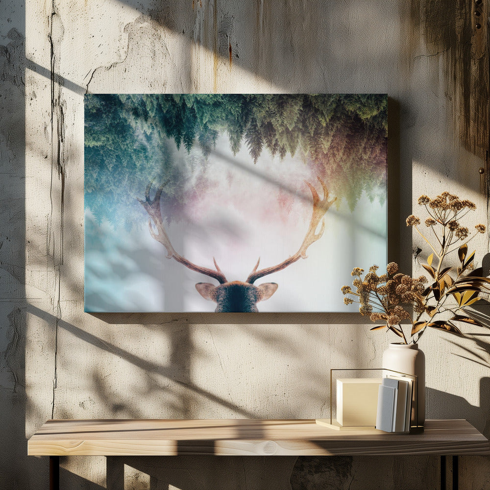 A surreal double-exposure artwork featuring the back of a deer's head with large antlers, blended with an image of a misty pine forest. The forest is reflected above the antlers against a soft, pastel-colored background, all enclosed in a silver frame. Print