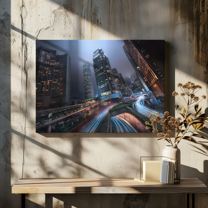 A dynamic, low-angle, long-exposure shot of a modern city at night. Towering skyscrapers with illuminated windows pierce through a foggy, dark blue sky. Below, curving highways are filled with the vibrant red and white light trails of moving traffic. Print