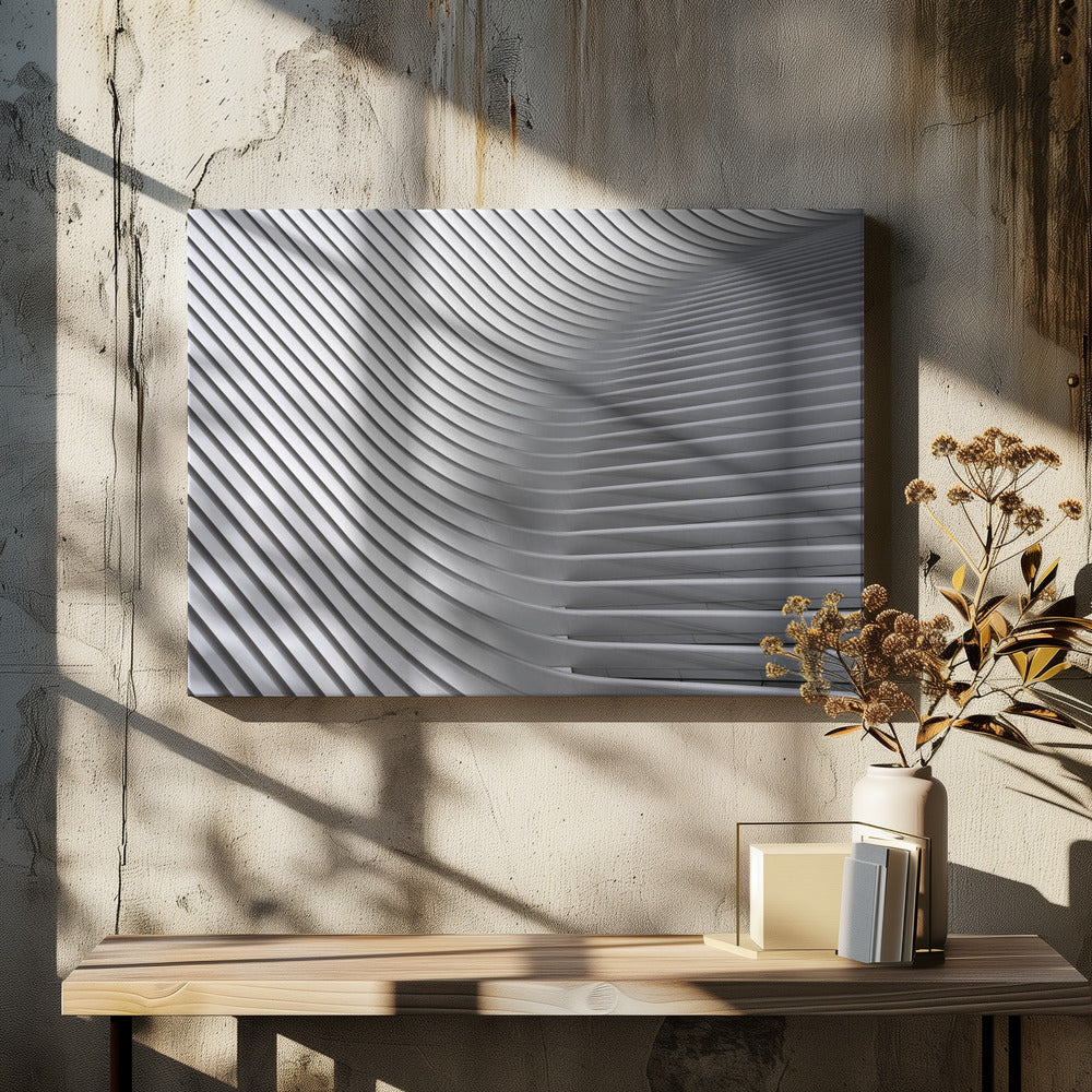 A framed, close-up, abstract photograph of a modern architectural structure. Parallel white ribs curve and undulate across the frame, creating a sense of movement and rhythm through the interplay of light and shadow. Artwork