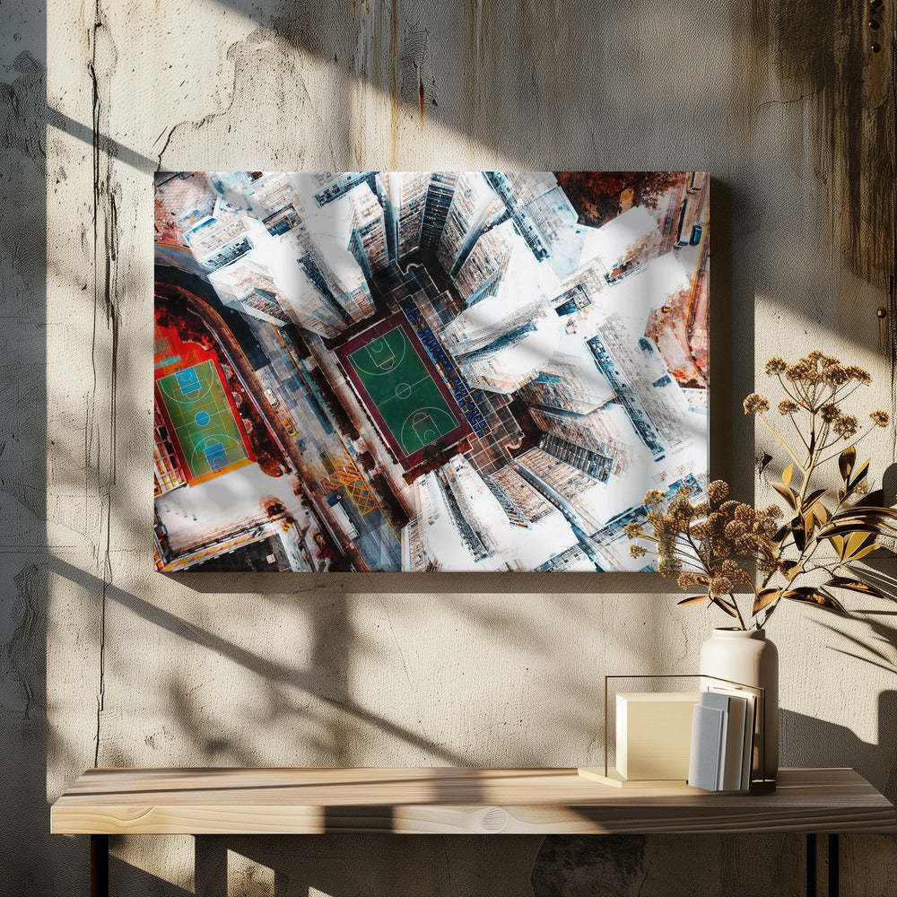 A dizzying top-down aerial view of a dense city, where stark white skyscrapers tower over two vibrant basketball courts, one green and the other multicolored. The abstract, high-contrast style highlights the geometric patterns of urban life, all enclosed within a silver frame. Poster