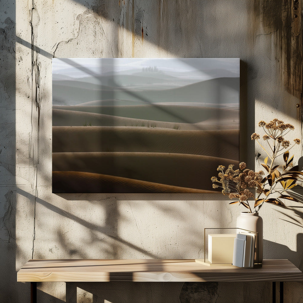 A framed photograph of a serene desert landscape, with layers of rolling sand dunes creating a sense of depth. Dark brown dunes in the foreground give way to lighter, hazy dunes and hills in the misty background. Print