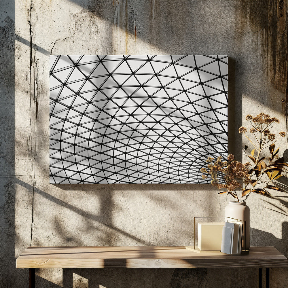 A framed, black and white photograph of a modern architectural dome ceiling. The image is a close-up, looking up at the intricate metal framework that creates a repeating pattern of triangles against the bright glass panels. Poster