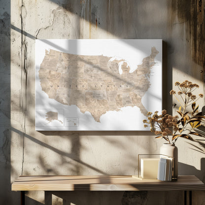A framed map of the United States with a textured, marbled design in shades of brown and tan. Each state is outlined and labeled, and the words 'UNITED STATES' are displayed across the center. Alaska and Hawaii are shown in separate insets. The map is set against a white background and enclosed in a light gray frame. Artwork