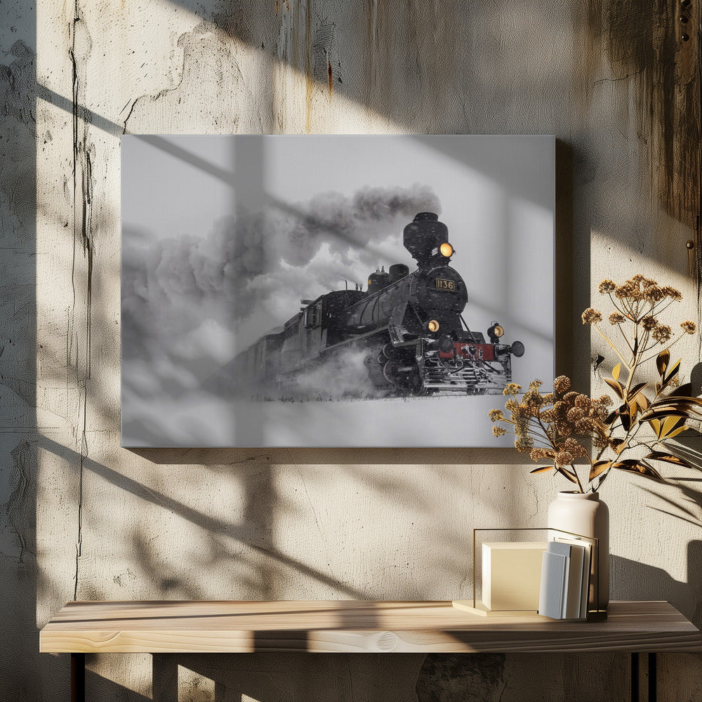 A dramatic black and white photograph of a classic steam train, number 1136, plowing through a heavy snowstorm, with its headlights glowing and a large plume of smoke trailing behind it. The image is presented within a silver frame. Print