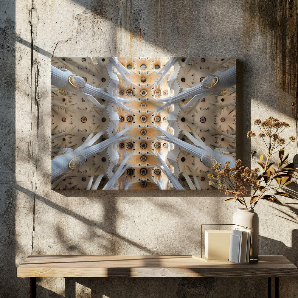 A symmetrical photograph looking directly up at the ornate, geometric ceiling of the Sagrada Familia. White, tree-like columns branch out to support the intricate vaulted ceiling, which is detailed with warm orange and gold starburst patterns. Decor